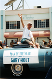 Gary Holt waving to crowd at Pride parade