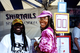 Makeda Dread in front of Shirtails booth at Pride festival, 1992