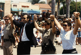 Police officers holding hands in the San Diego Pride parade, 1995
